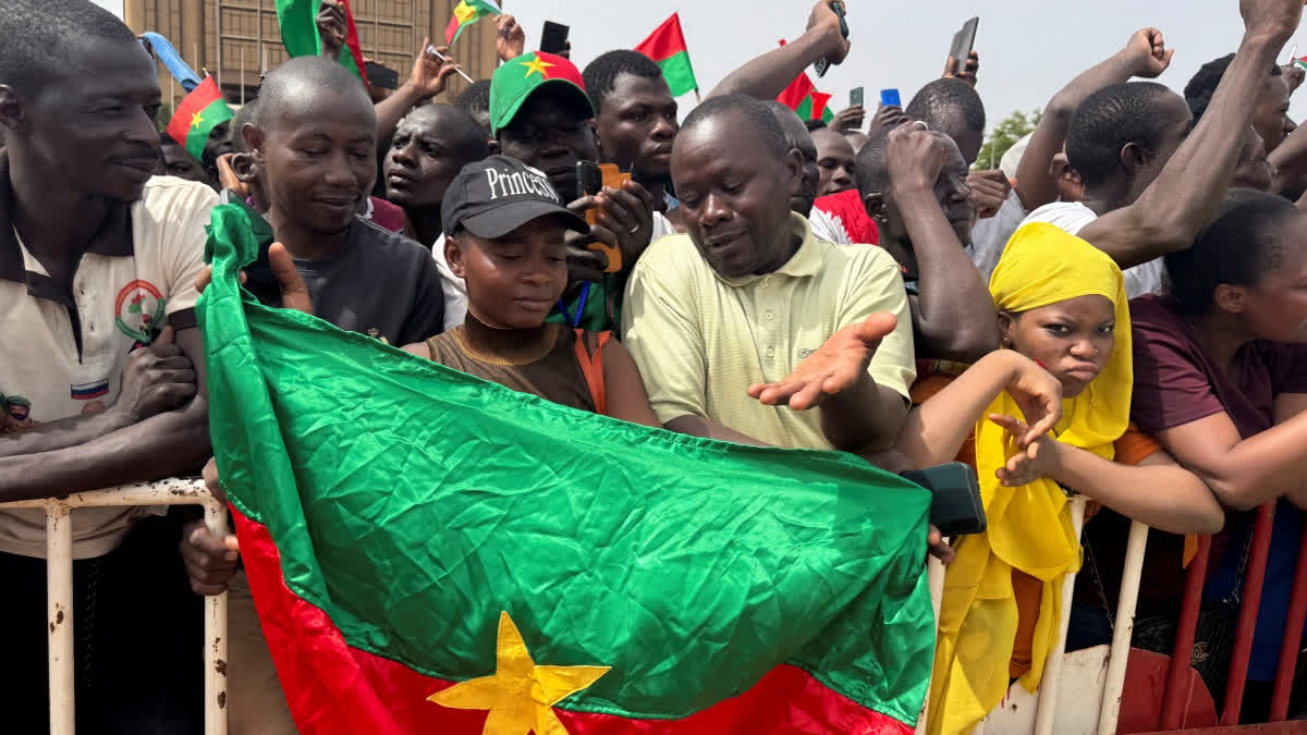 More Than 100 Killed in Jihadi Attack in Northern Burkina Faso Supporters of Burkina Faso's strongman Captain Ibrahim Traore wave Burkina Faso flags during a rally in support of Traore at Place de la Nation Ouagadougou on April 30, 2025.