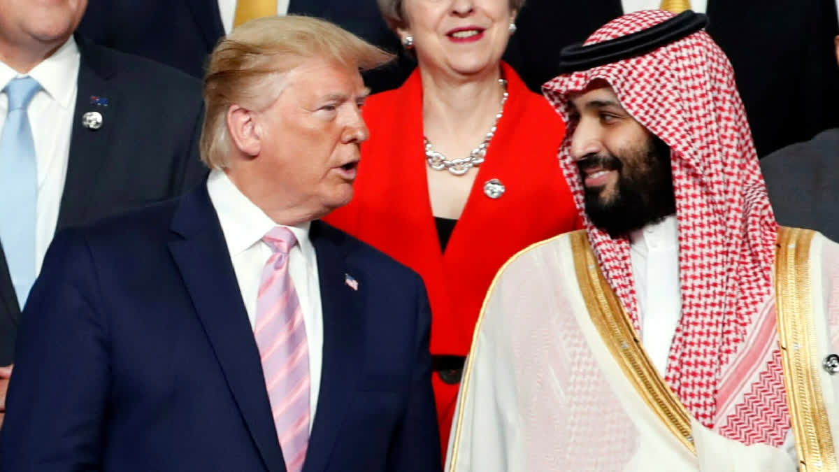 President Donald Trump, left, speaks with Saudi Arabia's Crown Prince Mohammed bin Salman during family photo session at G-20 leaders summit in Osaka, Japan, June 28, 2019.
