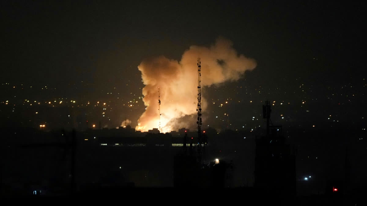 Smoke rises up after an explosion in Tehran, Iran, Friday, June 13, 2025.