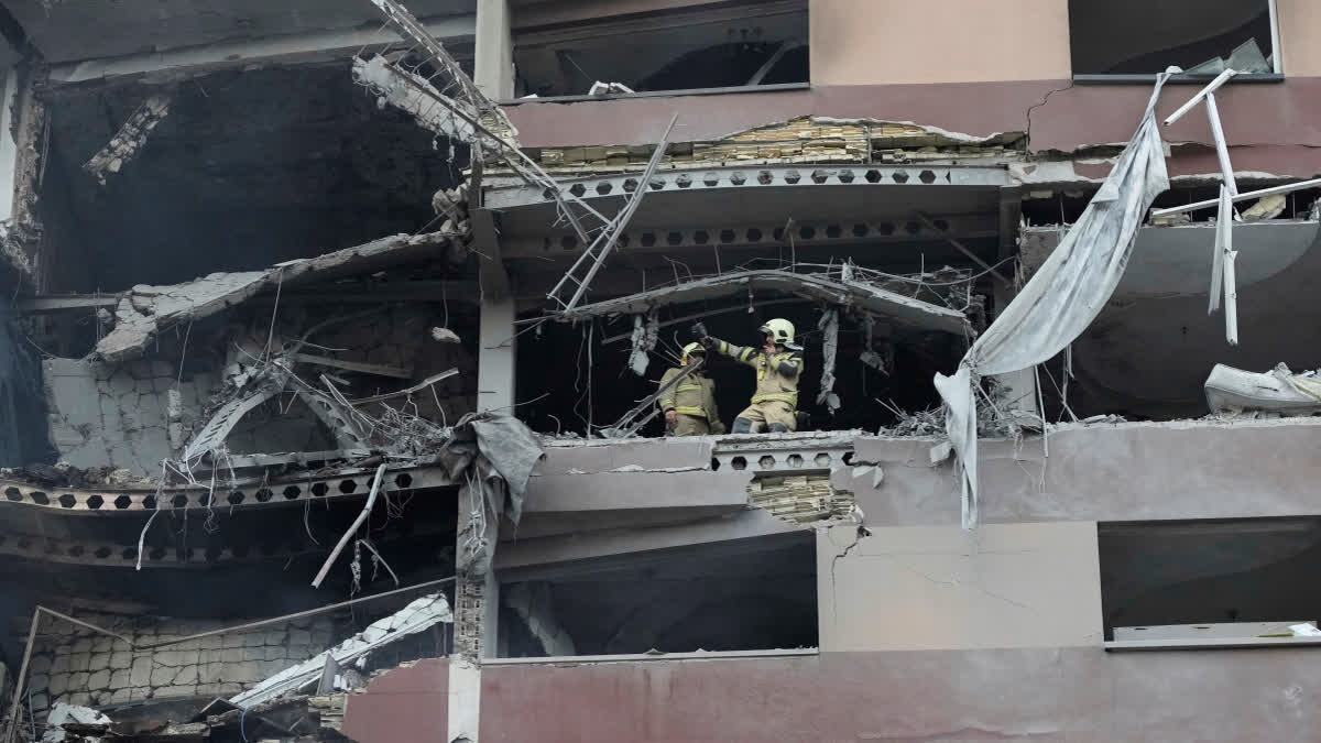 Firefighters work the scene of an explosion at a residence compound in northern Tehran, Iran, Friday, June 13, 2025.