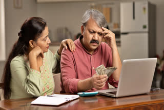 Middle aged couples with financial anxiety
