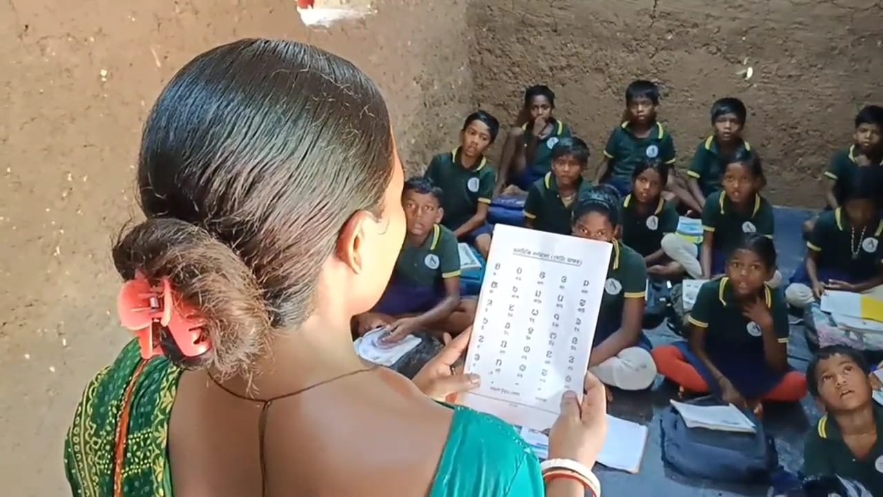 Malti teaches in a class.