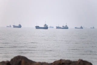 Commercial vessels are seen in the Strait of Hormuz off Bandar Abbas, Iran, Tuesday, June 30, 2026.