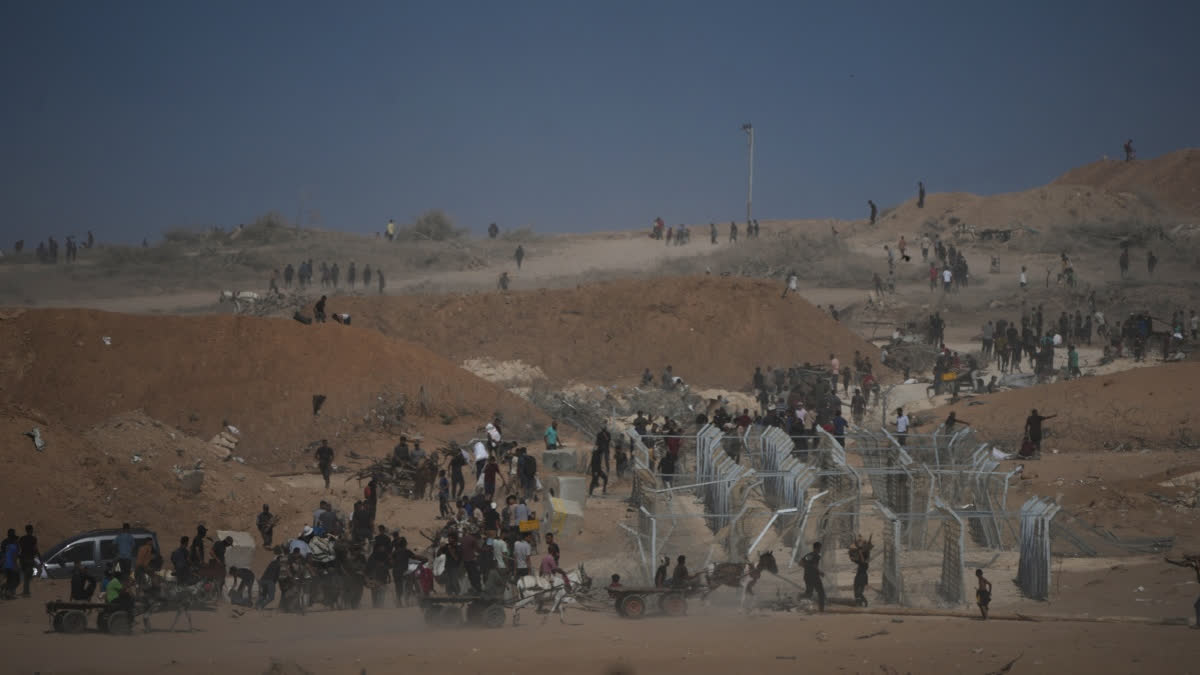 Officials Say Food Sites Run By Controversial US-Israeli-Backed Group In Gaza Are Being Shut Down Palestinians inspect the remains of a site that housed a distribution center operated by the U.S.-backed Gaza Humanitarian Foundation (GHF) in Netzarim, central Gaza Strip, Friday, Oct. 10, 2025.