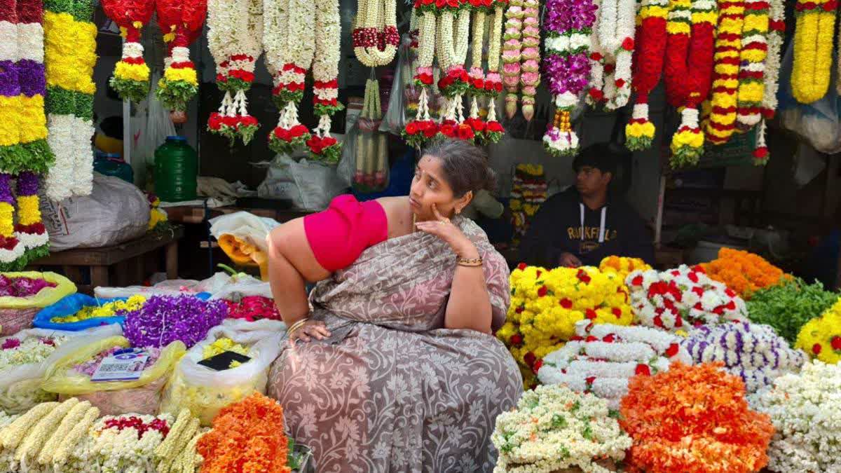 A flower seller at Malleshwaram market.