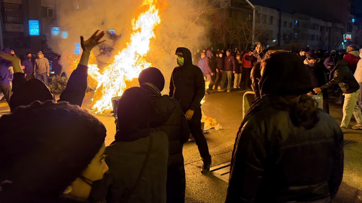 In this photo obtained by The Associated Press, Iranians attend an anti-government protest in Tehran, Iran, Friday, Jan. 9, 2026.