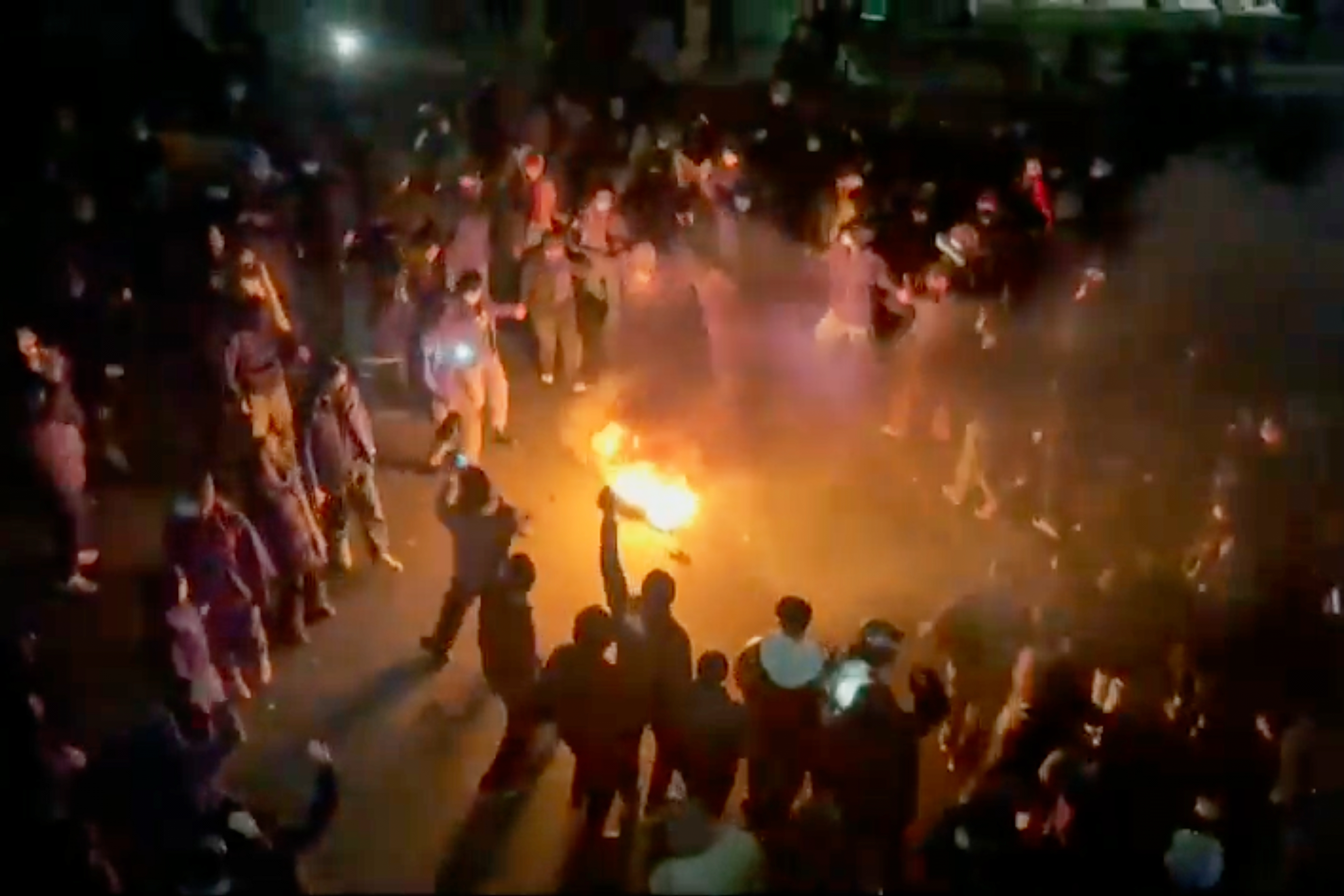 FILE - This frame grab from footage circulating on social media shows protesters dancing and cheering around a bonfire as they take to the streets despite an intensifying crackdown as the Islamic Republic remains cut off from the rest of the world, in Tehran, Iran, Jan. 9, 2026.