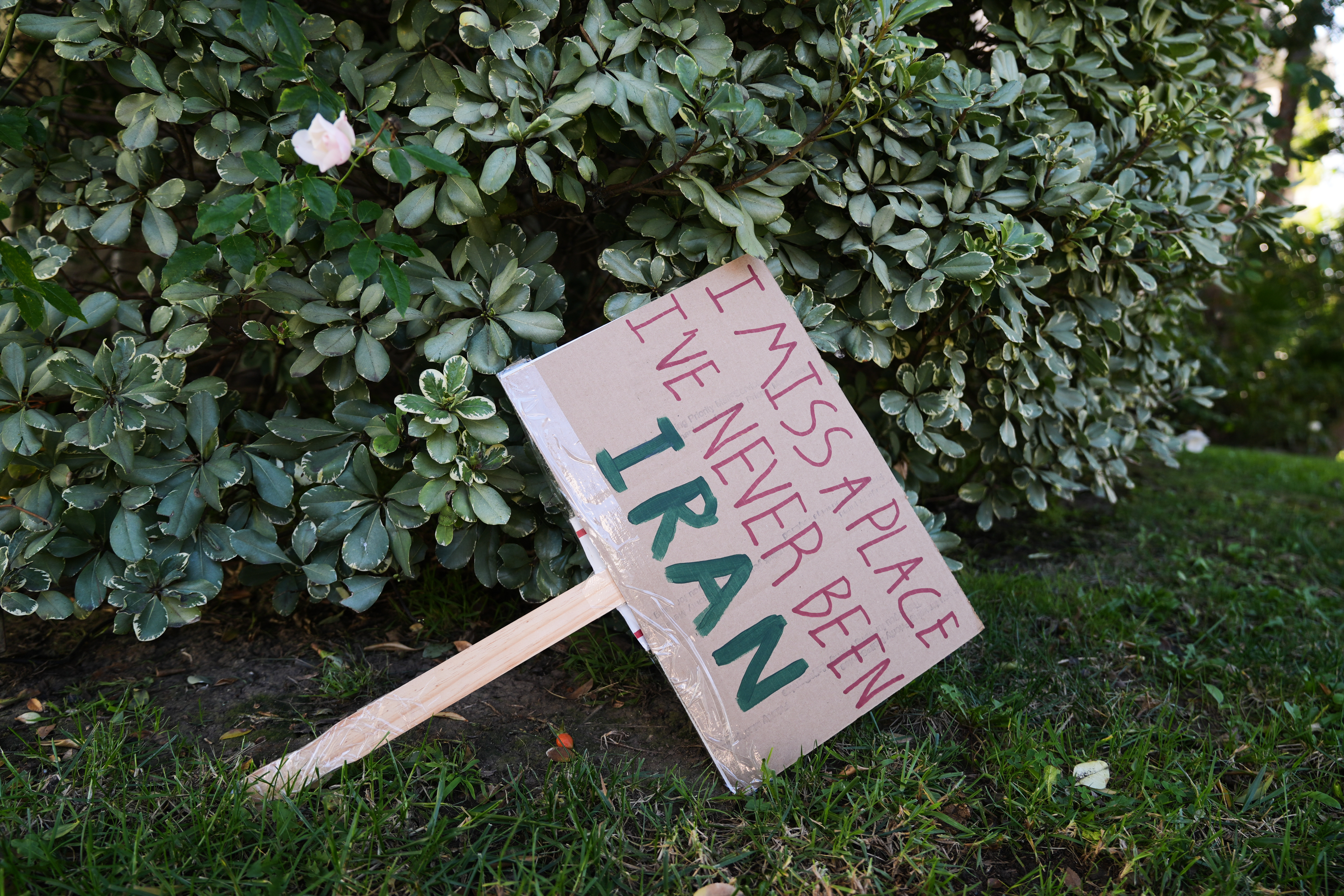 Signs from a Sunday protest, supporting protesters in Iran, are left on a yard Monday, Jan. 12, 2026, in Los Angeles.