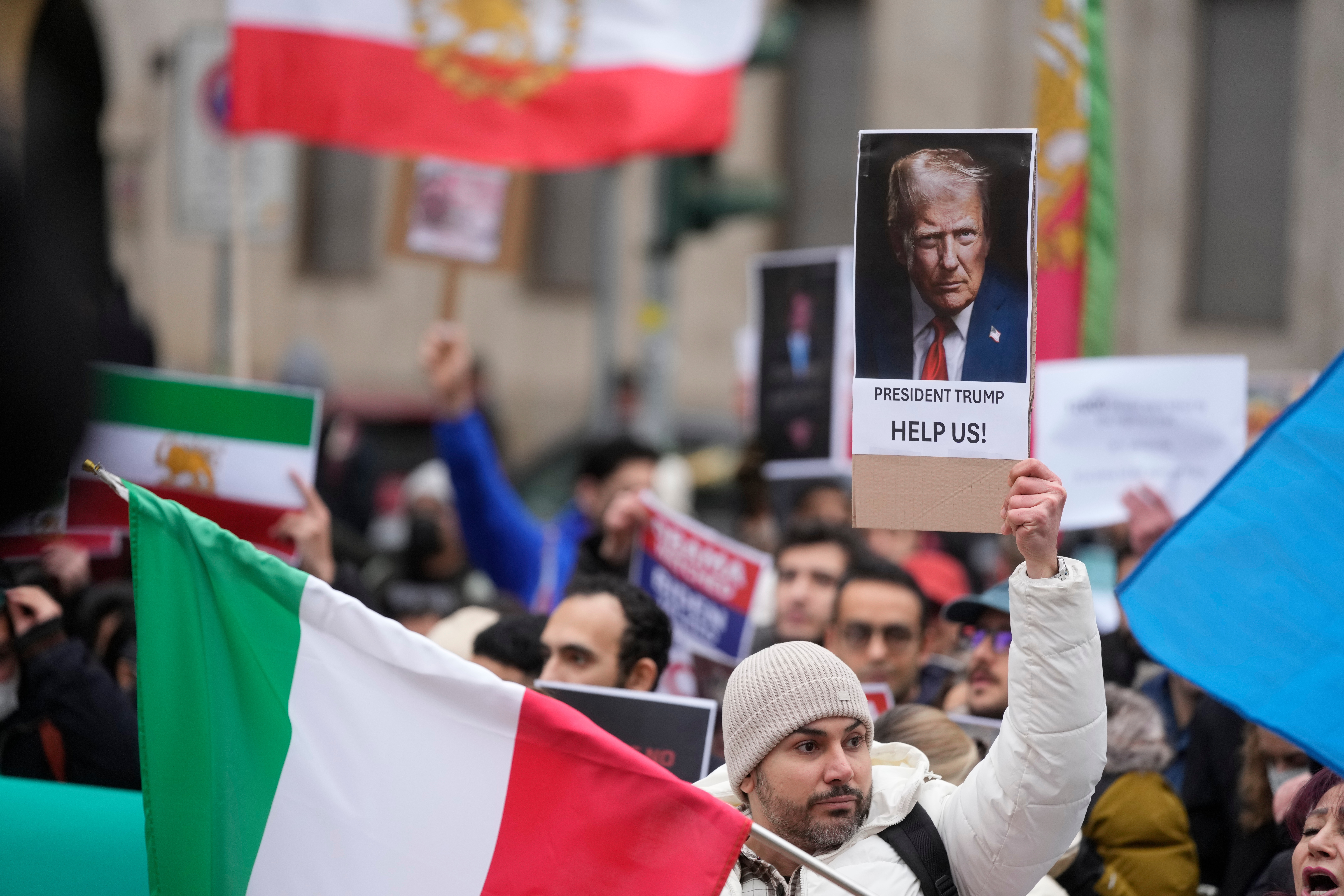 Protesters participate in a demonstration supporting protesters in Iran, in front of the US Consulate, Milan, Italy, Tuesday, Jan. 13, 2026.