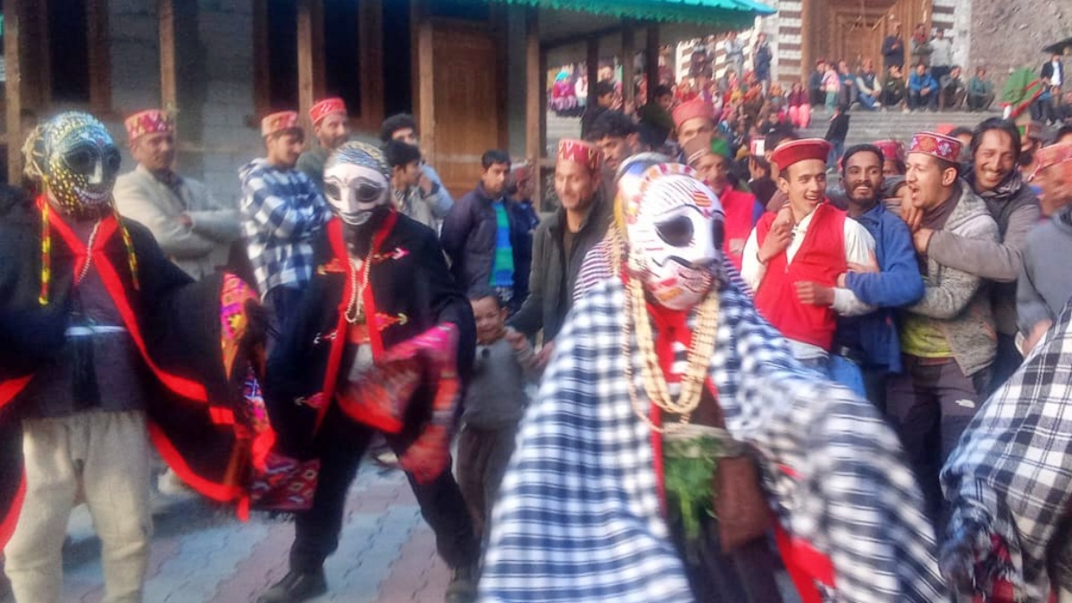 People wear scary wooden masks on Fagli festival in Kullu