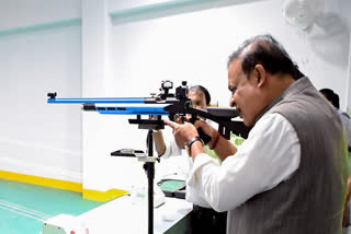 Assam Chief Minister Himanta Biswa Sarma tries rifle firing at a sports complex, on Feb. 2, 2026.