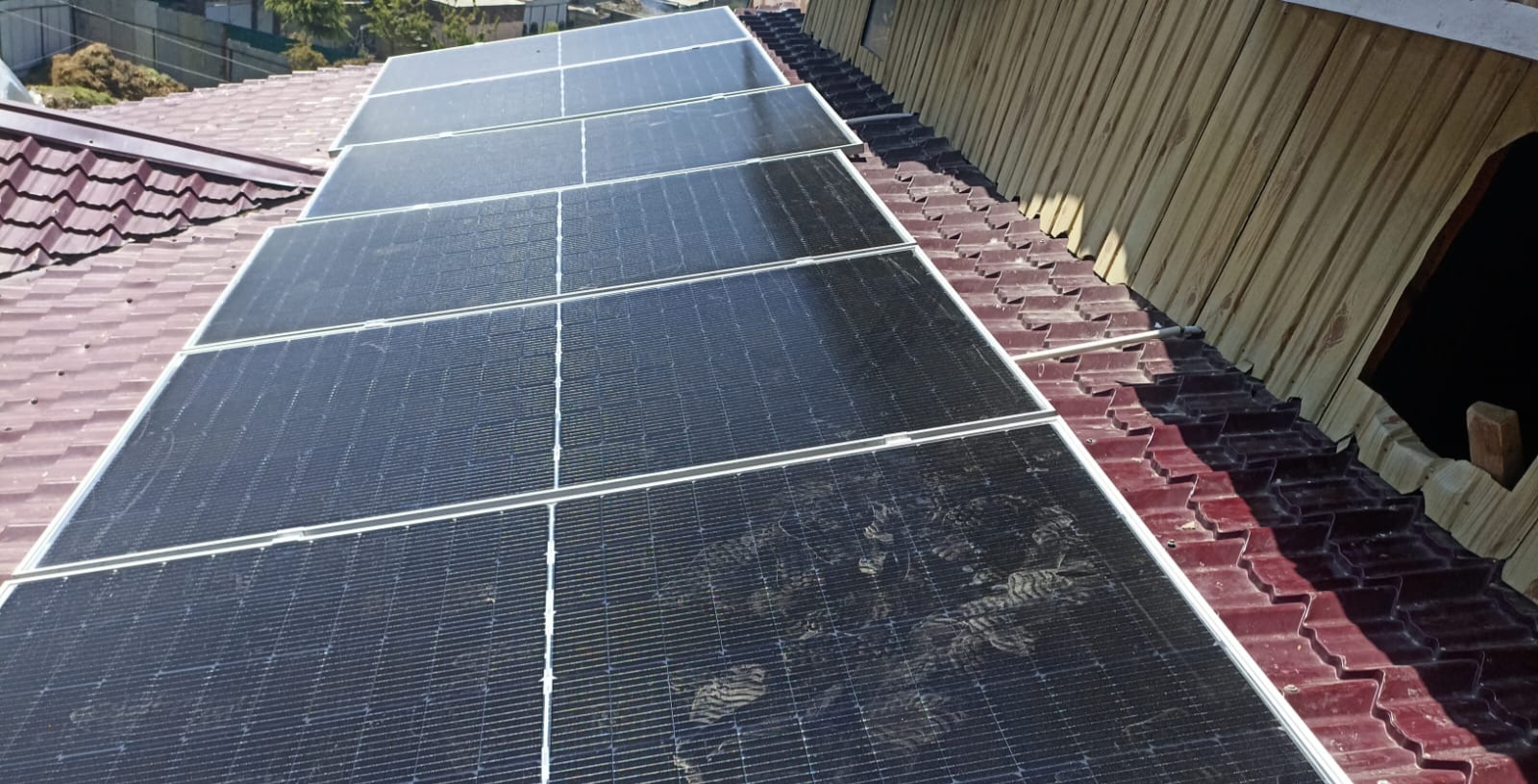 Solar panels mounted on a rooftop of a house in Kashmir
