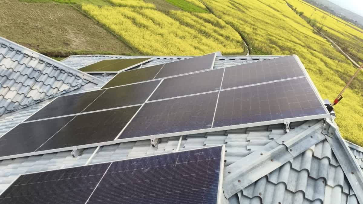 Solar panels mounted on a rooftop of a house in Kashmir