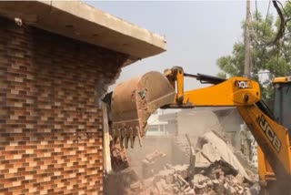 BULLDOZER ACTION TAKEN ON HOUSE