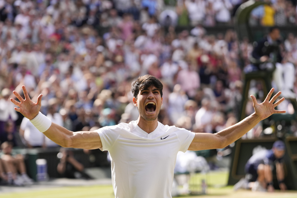 Alcaraz celebrates after defeating Novak Djokovic.