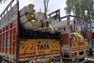 Trucks carrying tents and other equipment for the Rahul Gandhi rally, outside Dehradun's Parade Ground