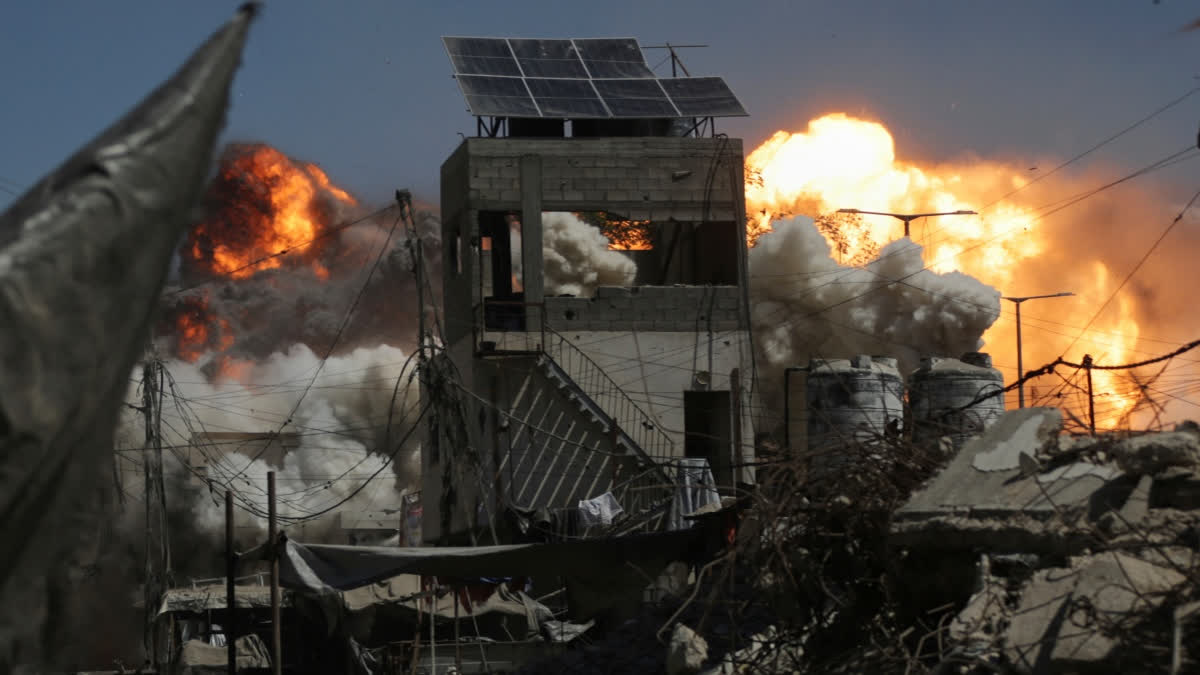 Smoke and flames rise after an Israeli military strike on a building in Gaza City, Saturday, Sept. 13, 2025.