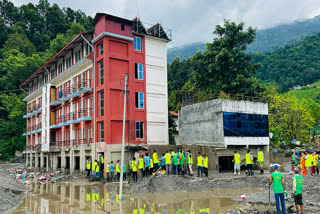 Volunteers of Manav Dharma Nepal Seva Samiti carry out a cleanliness drive in flood-affected Devighat, clearing debris and waste from the premises of an old-age home (Vriddha Ashram), in Nuwakot district, Nepal, on Monday, September 07, 2026.