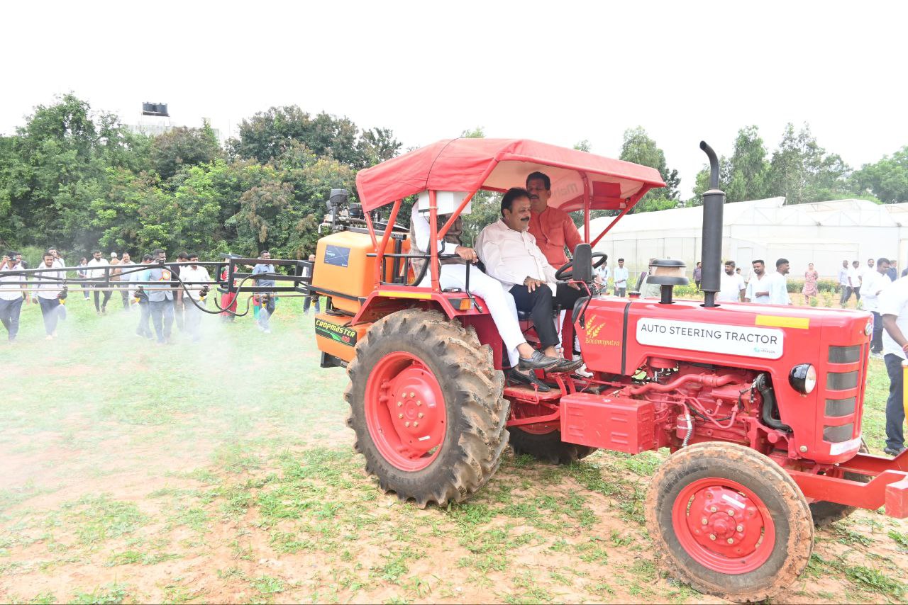 Karnataka Agriculture Minister N. Chaluvarayaswamy drives a tractor at Bengaluru Krishi Mela 2024