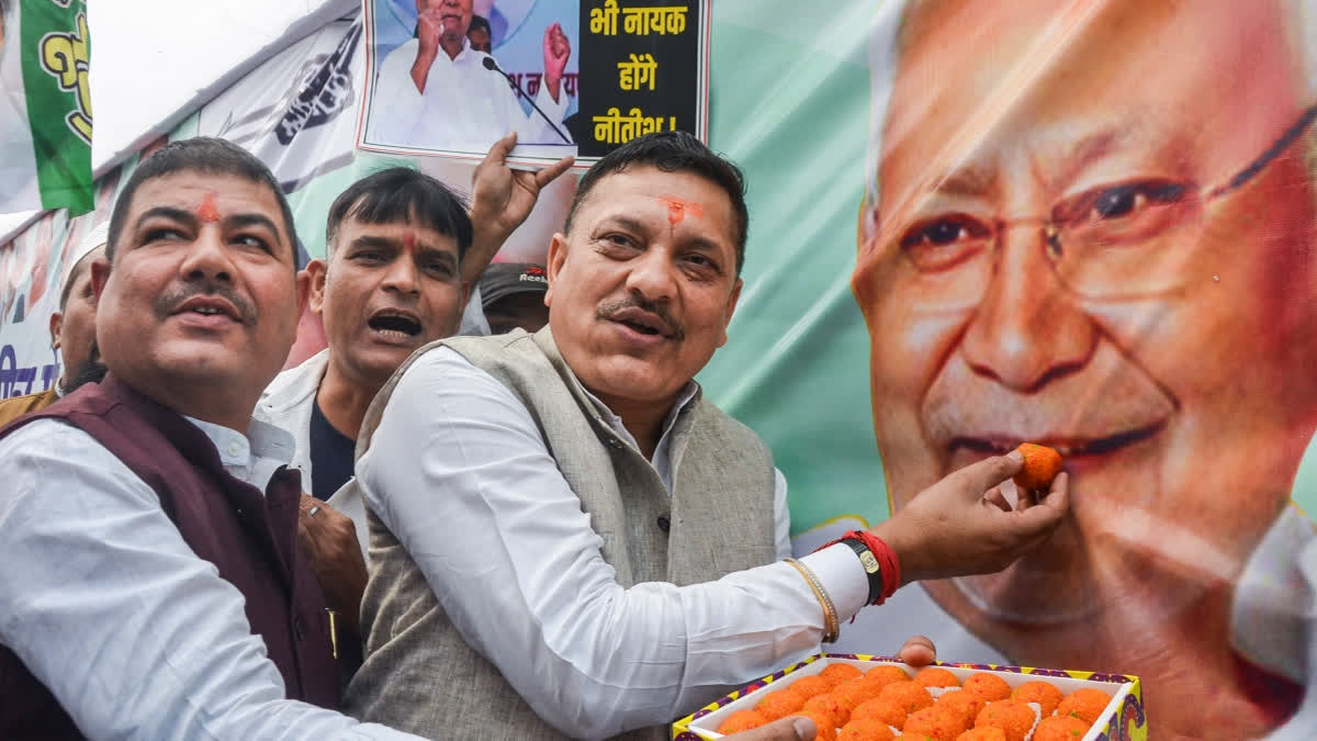 JDU members celebrate as the NDA alliance leads during the counting of votes of the Bihar Assembly elections, in Patna, Friday, Nov. 14, 2025