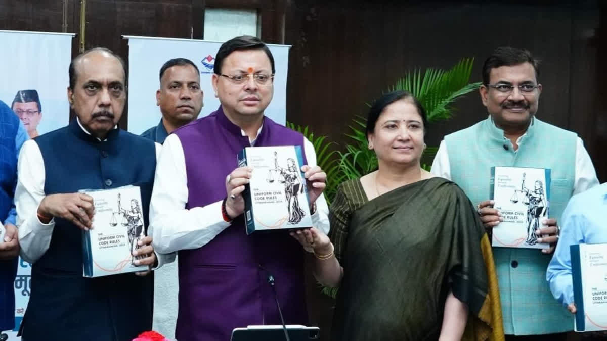 Uttarakhand CM Pushkar Singh Dhami, others, with state UCC Rulebook