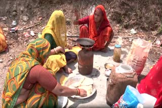 Women, part of a Kitchen Group cook meals during Char Dham Yatra