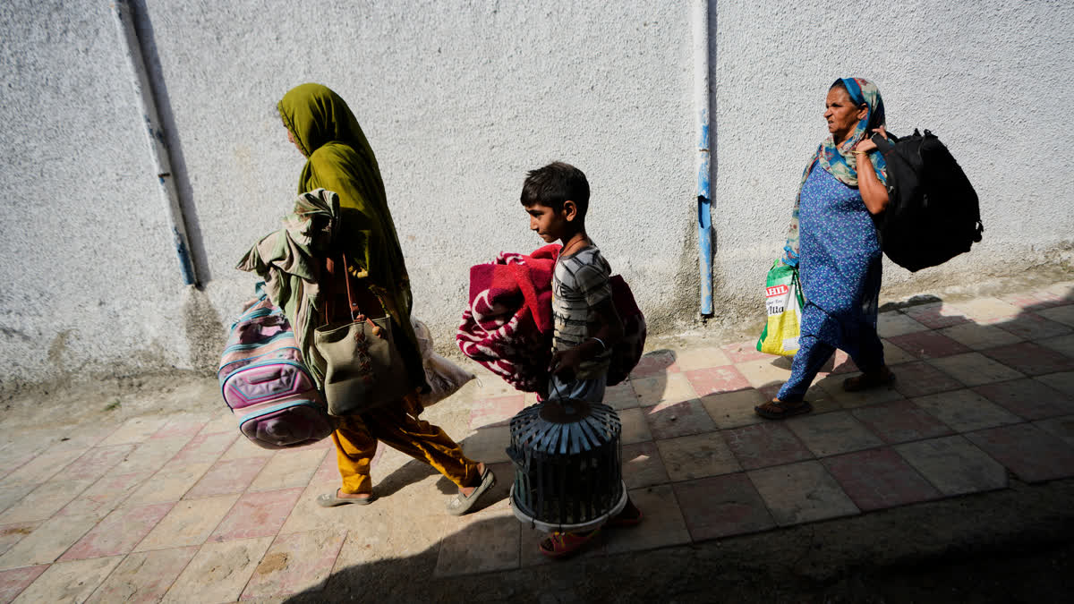 No Radiation Leak From Any Nuclear Facility In Pakistan: IAEA Villagers living along the Line of Control between India and Pakistan return to their village from temporary shelters, in Akhnoor Sector, India.