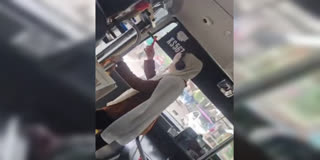 KOZHIKODE BUS STOP DISPUTE  WOMAN BREAKS KSRTC BUS GLASS  KSRTC BUS GLASS BREAK  KOZHIKODE