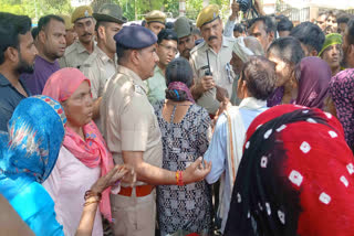 Police attempting to pacify the patient's relatives