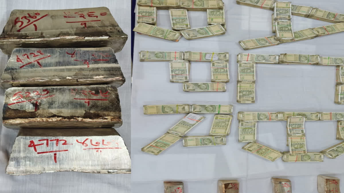 Silver bars and cash recovered from the AEN's premises.