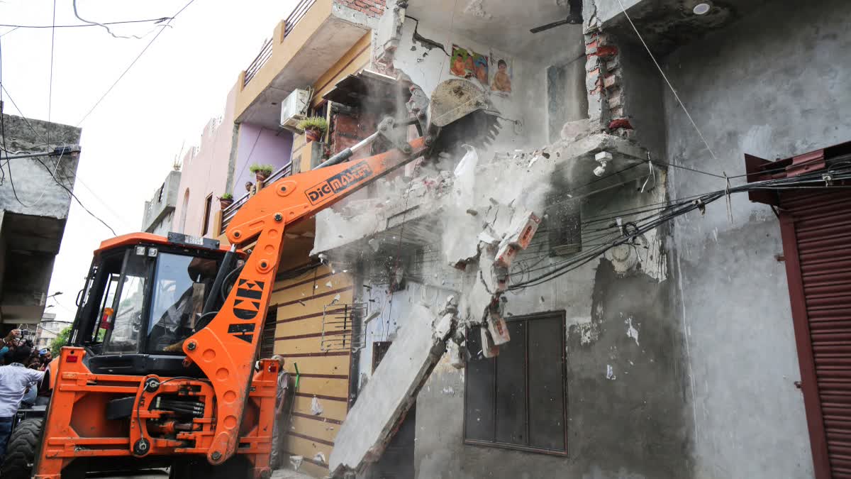 Punjab Police, with the local district administration, carries out bulldozer action to demolish a drug smuggler's house under the anti-drug campaign 'Yudh Nashian Virudh' (War Against Drugs) launched by the Punjab government, in Amritsar.