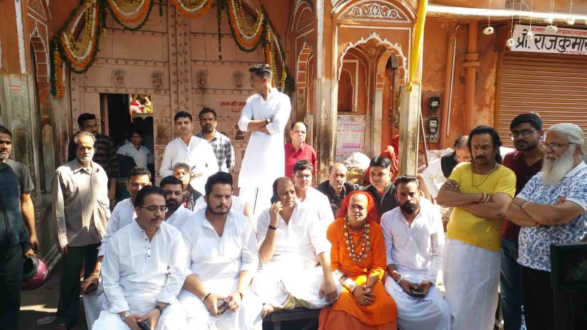 Priests protest outside the Tadkeshwar Mahadev Temple.