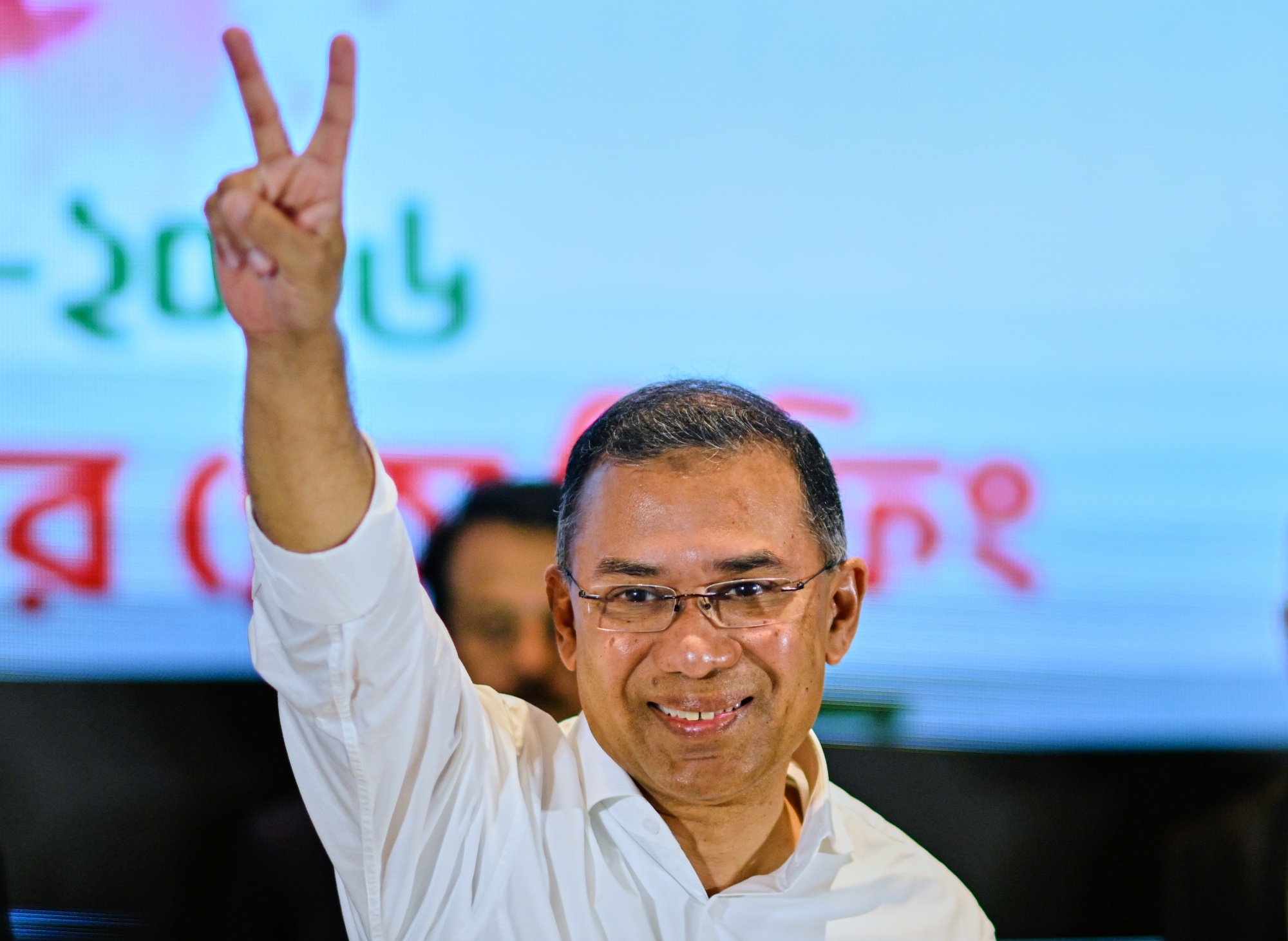 Bangladesh Nationalist Party (BNP) chairman Tarique Rahman shows victory sign after addressing a press conference in Dhaka on February 14, 2026