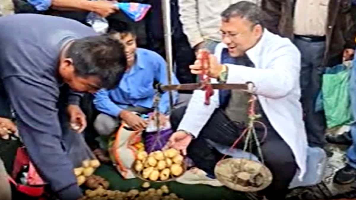 Bimal Bora sells potatoes