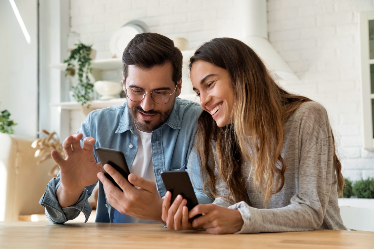 Couple looking at their phones