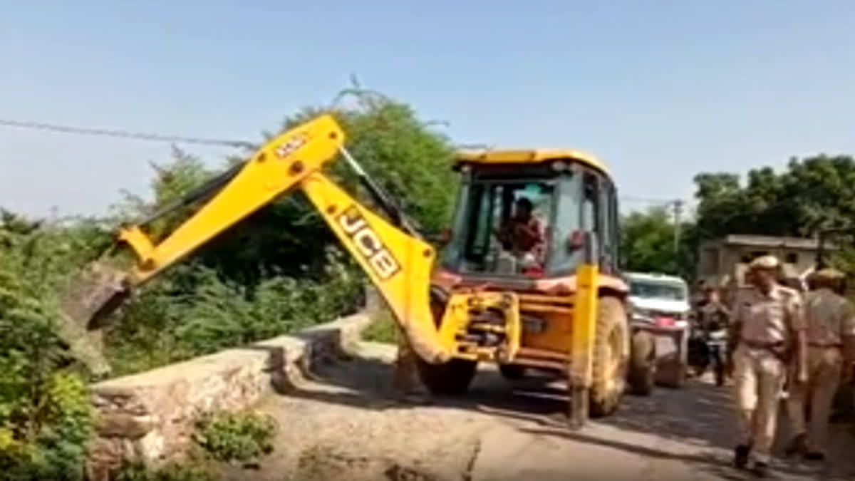 Bulldozer removing encroachment