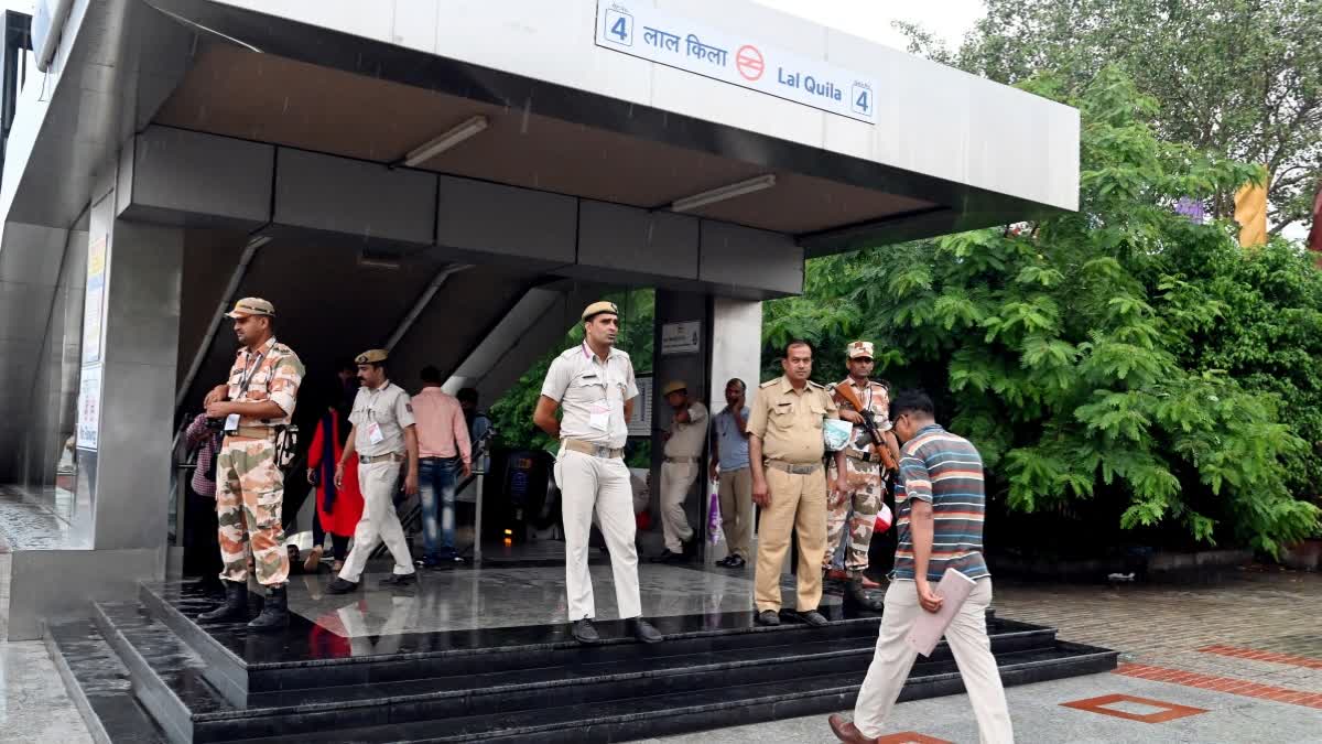 Police and Paramilitary personnel stand guard outside Lal Quila Metro Station near Red Fort in New Delhi