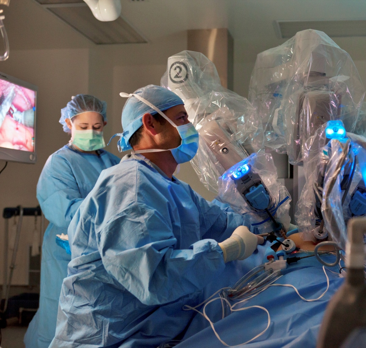 A surgeon performs robotic surgery