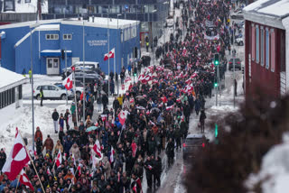 A crowd walks to the US consulate to protest against Trump's policy towards Greenland in Nuuk, Greenland, Saturday, Jan. 17, 2026.
