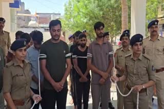 The accused at the Kheda Town police station after their arrest.