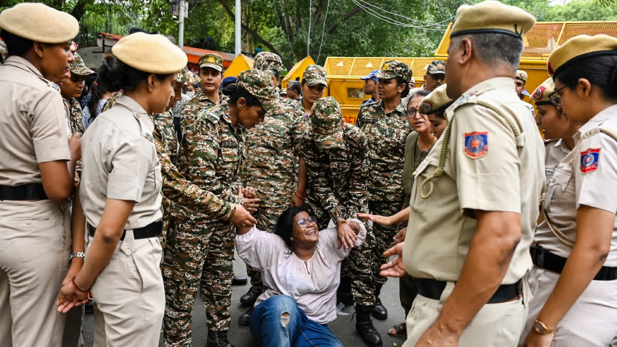Security personnel detain a supporter of the Cockroach Janata Party (CJP) after activist Sonam Wangchuk, unseen, who has been on an indefinite hunger strike for 21 days, is shifted to a hospital from Jantar Mantar, in New Delhi, on Saturday.