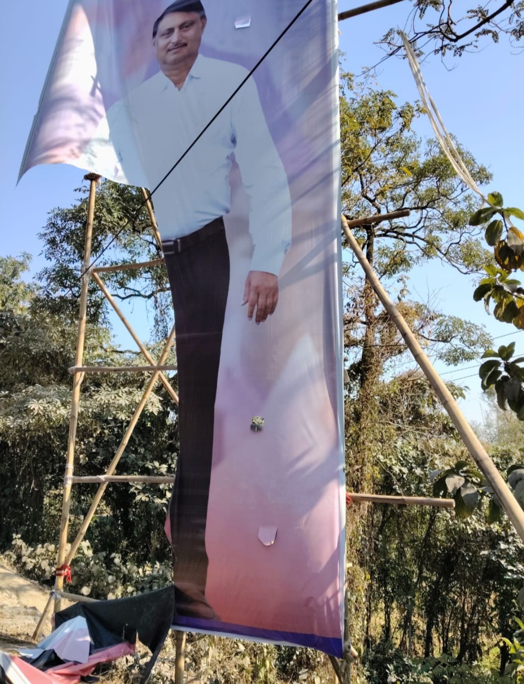 miscreant throwing banner-poster in Lakhimpur