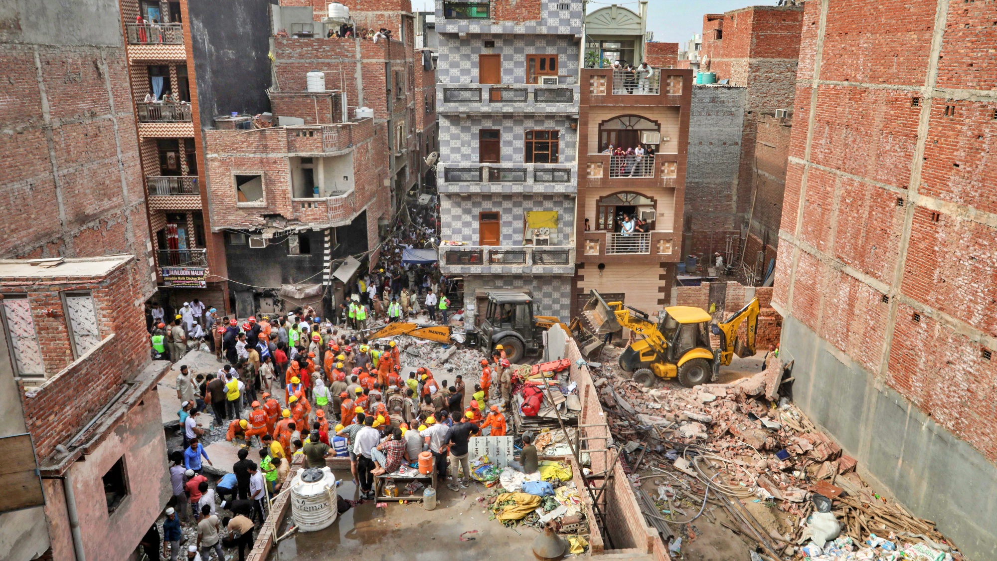 Rescue operation underway after a building collapsed at Shakti Vihar area, in New Delhi, Saturday, April 19, 2025.