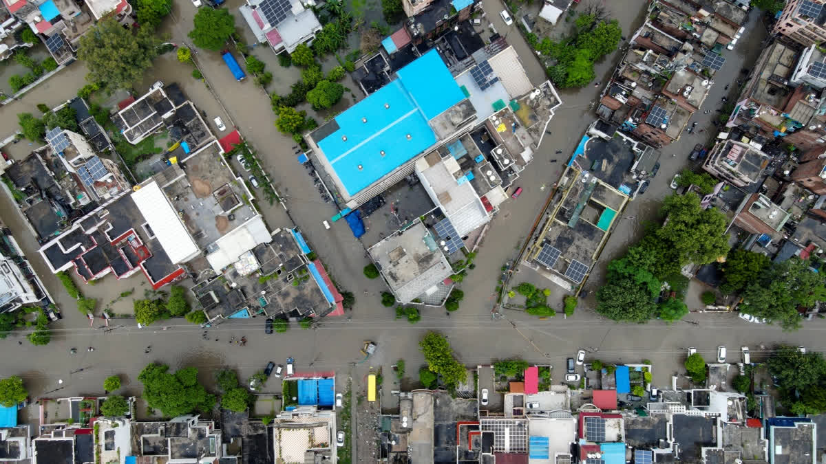 An aerial view shows waterlogged residential areas and flooded streets following heavy monsoon rains, in Prayagraj, Uttar Pradesh