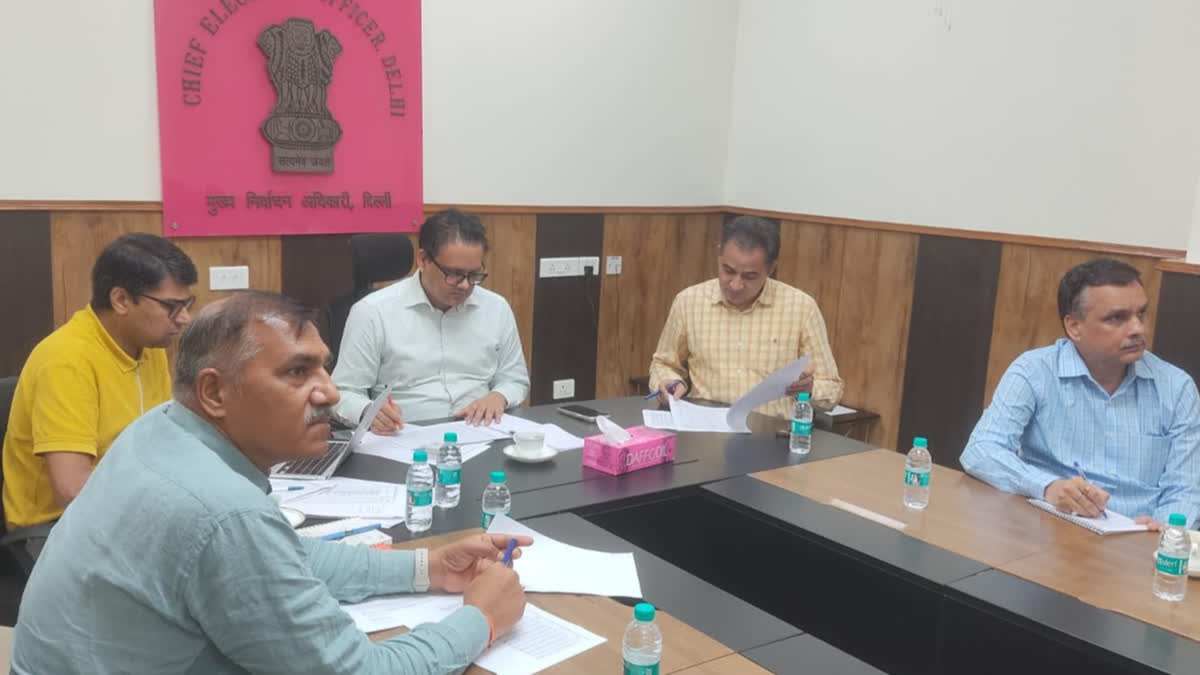 Delhi CEO Ashok Kumar with other EC officials