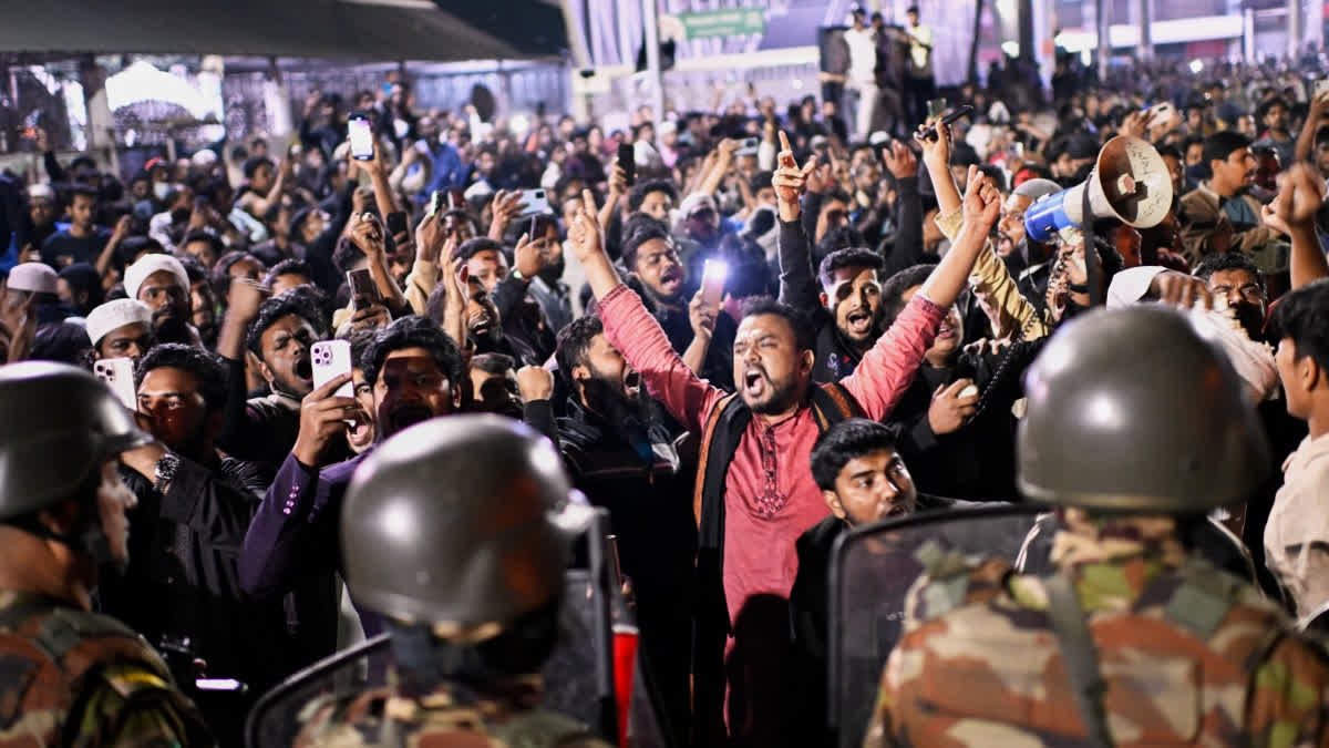 Protesters shout slogans in front of the premises of the Prothom Alo daily newspaper after news reached the country from Singapore of the death of a prominent activist Sharif Osman Hadi, in Dhaka, Bangladesh, Friday, Dec. 19, 2025.