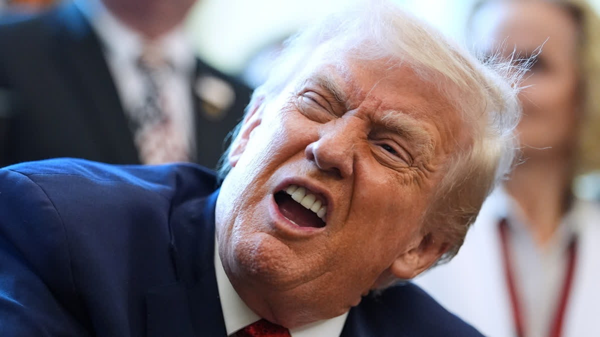 President Donald Trump speaks to reporters after signing an executive order reclassifying marijuana as a less dangerous drug in the Oval Office of the White House, Thursday, Dec. 18, 2025, in Washington.