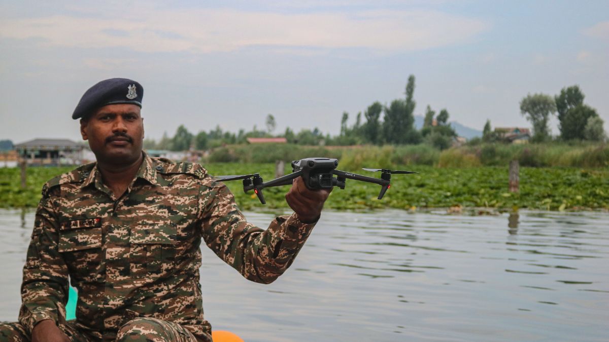 An Indian paramilitary soldier controls a surveillance drone on the eve of India's Independence Day in Srinagar, Jammu and Kashmir, on August 14, 2025