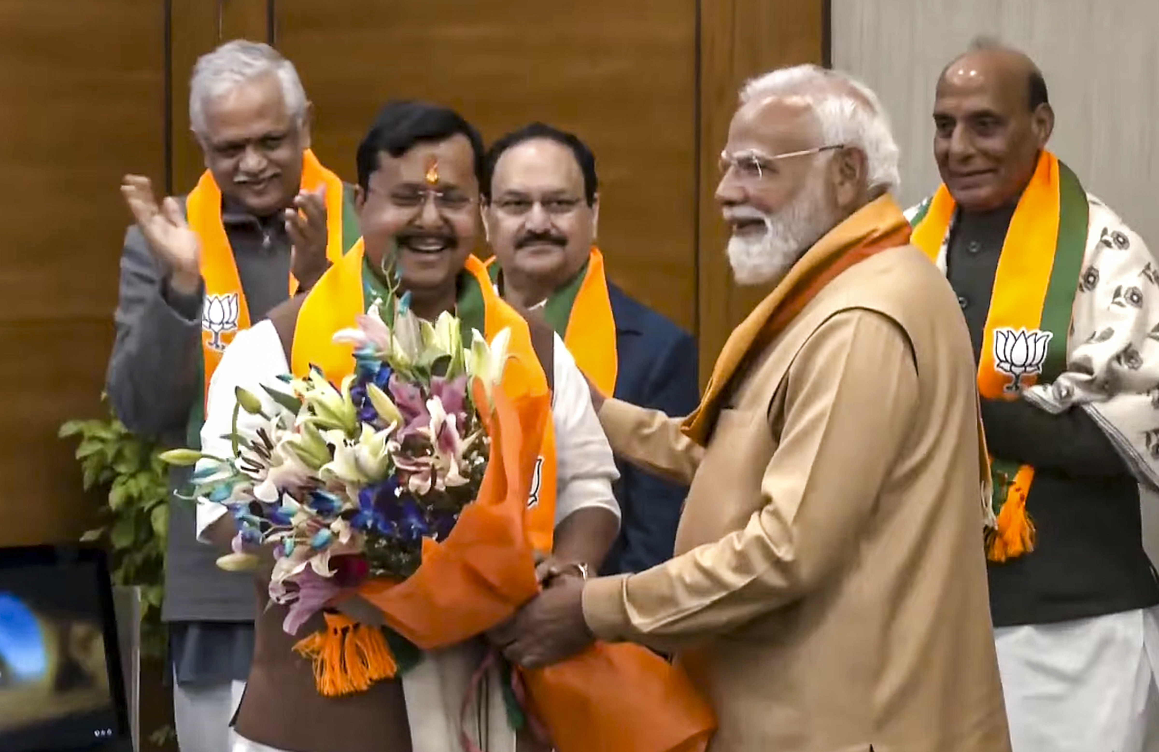 Prime Minister Narendra Modi felicitates newly elected BJP National President Nitin Nabin after the latter assumed charge, at party headquarters, in New Delhi.