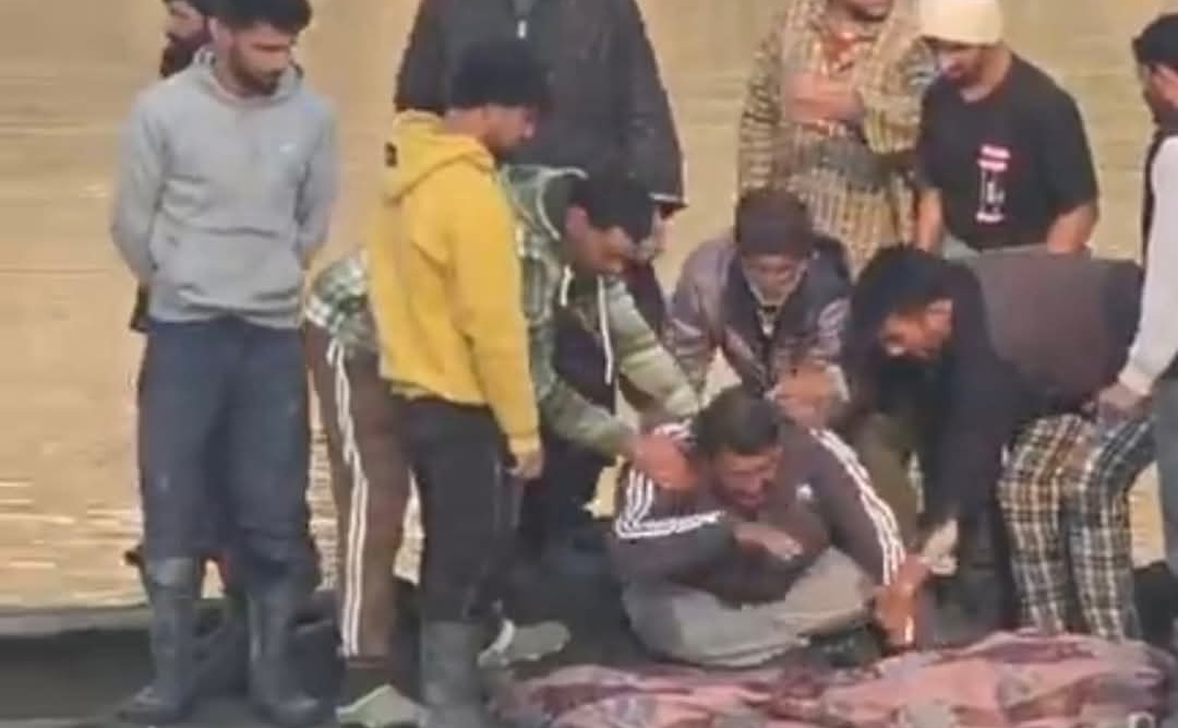 Locals carry the body of Showkat Ahmad Sheikh recovered from Jhelum after 21 months